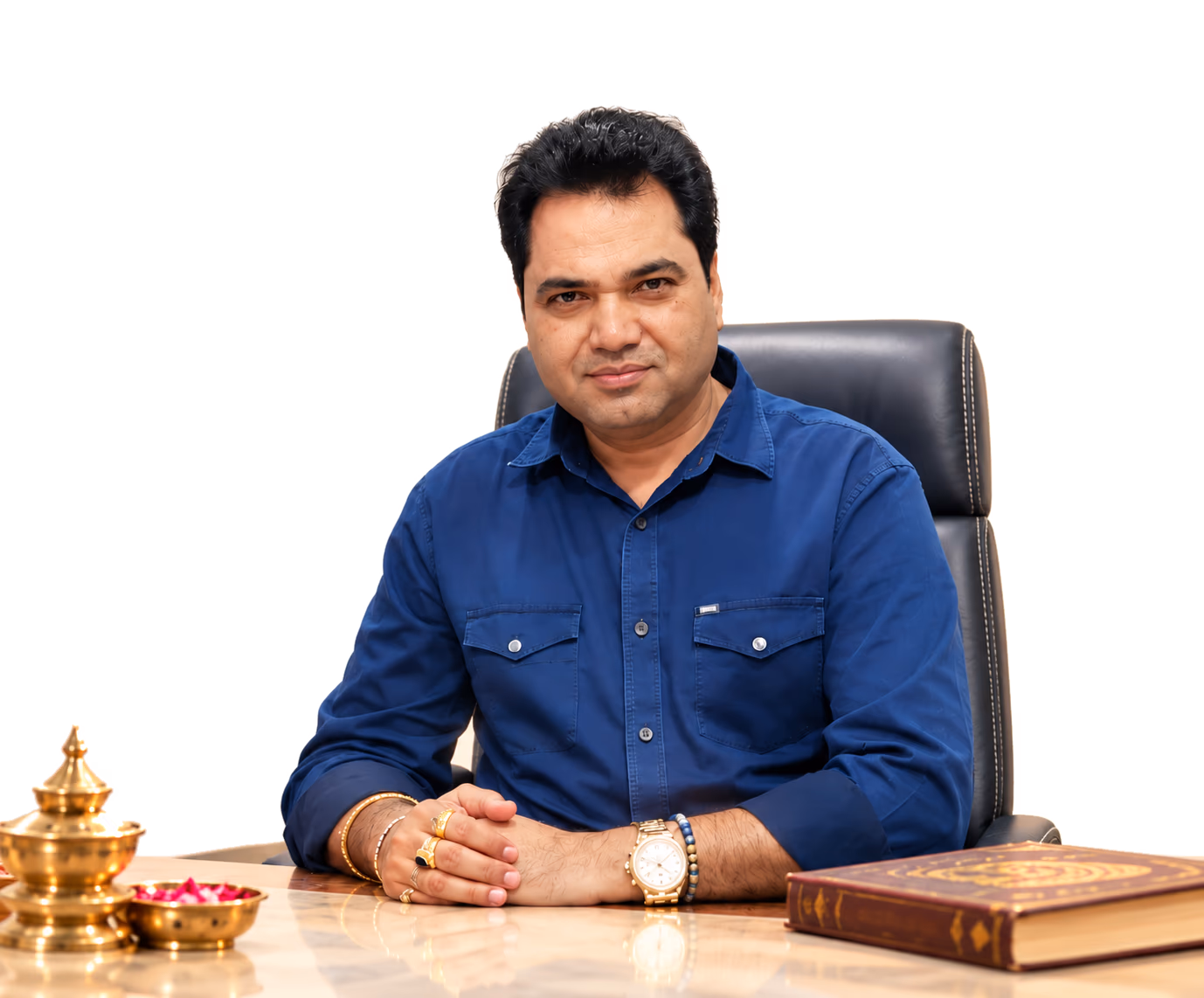 Acharya Kisshor, astrologer and Reiki healer, at his desk in Navi Mumbai